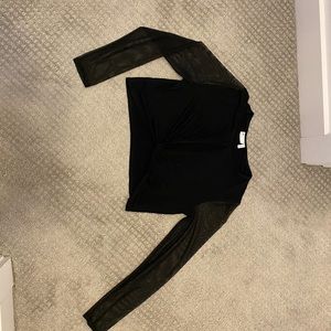 Black crop top. Key hole opening in front